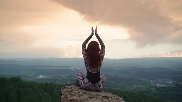 Girl Practices Yoga While Sitting in Lotus Position Beautiful Mountain Landscape