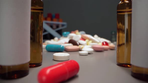 Zoom in Video of Medication Pills and Vials on Table Close Up