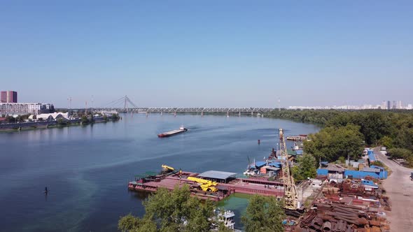 A Dry Cargo Ship Pushes an Empty Barge Down the Dnieper River