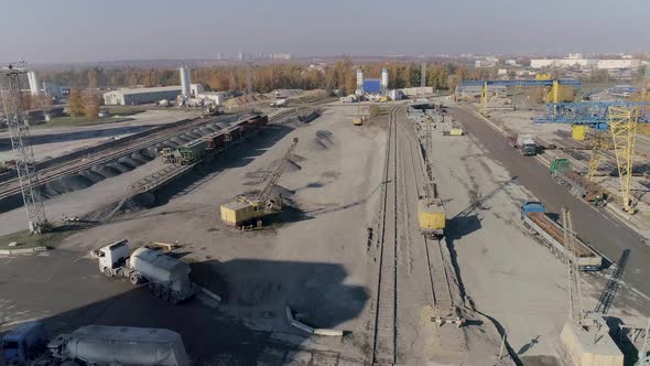 Aerial View at Heavy Construction Equipment on Hub of Construction Logistics alt