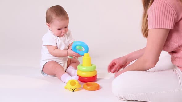 Baby Play with Pyramid at White Background