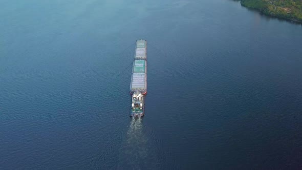 Cargo Ship Floating on River