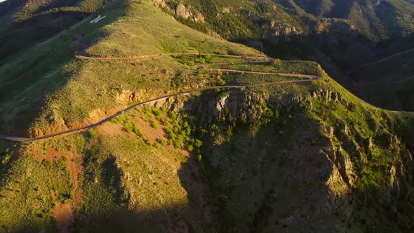 Aerial Footage Of Winding Mountain Road Near Golden Colorado USA During Beautiful Sunset.