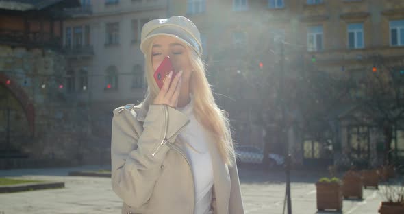 Woman Using a Smartphone Voice Recording Function Online in the City Street, Talking To Mobile