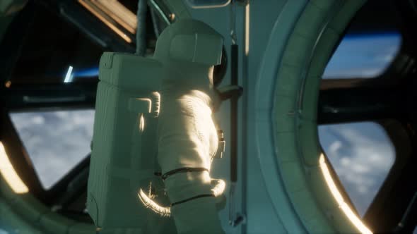 Astronaut Inside the Orbital Space Station alt