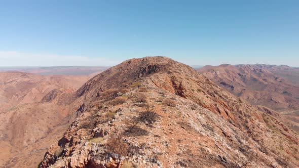 Aerial shot, People hiking in rugged elevated landscape, Central Australia