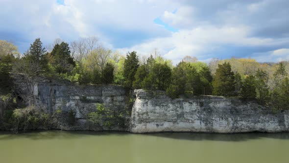 Aerial View of a White Picturesque Cliff Above the Riverside on the Sunset