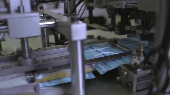 Medical Mask on Conveyor Belt in the Workshop