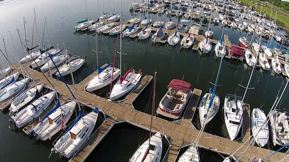 Aerial footage of sailboat marina.