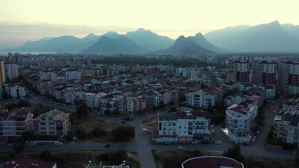 Beautiful Cityscape with Modern Buildings and Mountains in the Background