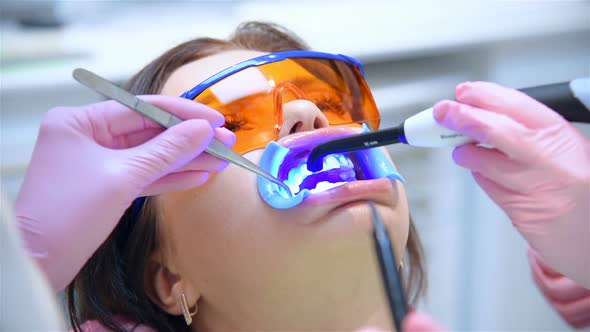 Dentist Prepares Patient For Teeth Whitening Procedure