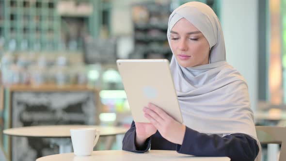 Serious Professional Young Arab Woman Using Tablet