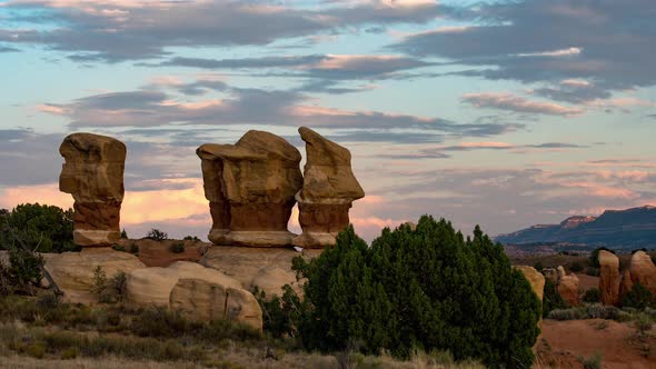 Sunset time lapse looking over rock formations in the desert