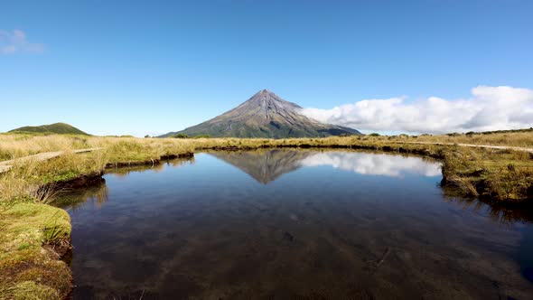 Timelapse of clouds rolling around base of Mount Taranki. Shot with reflection from the Pouakai tarn