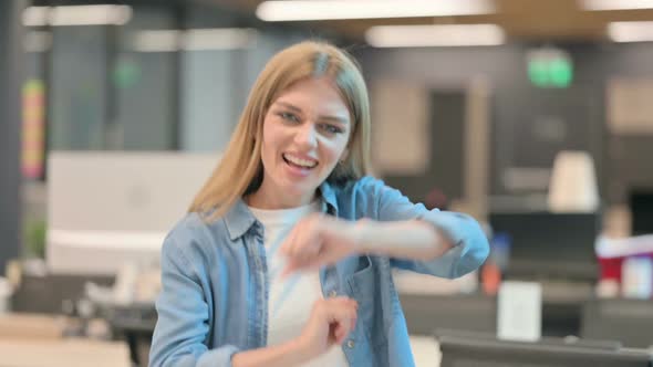 Happy Young Woman Dancing with Joy