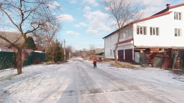 Boy Running On The Winter Street Slow Motion