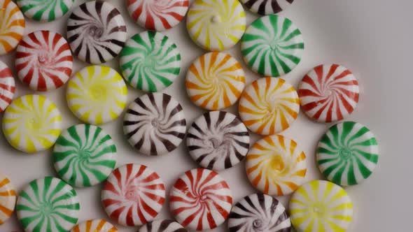 Rotating shot of a colorful mix of various hard candies