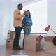 Couple unpacking belongings in their new flat - VideoHive Item for Sale