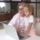 Child and Granny Looking at the Camera with Laptop - VideoHive Item for Sale