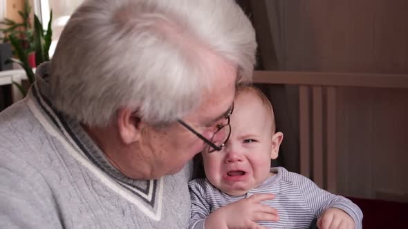 Family Relations of Elderly Male and Crying Baby Girl