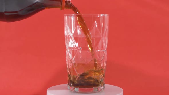 Coke bubbling in a glass.