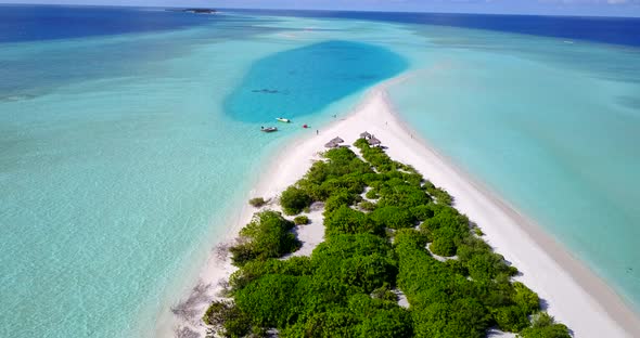 Daytime above tourism shot of a paradise sunny white sand beach and aqua turquoise water background 