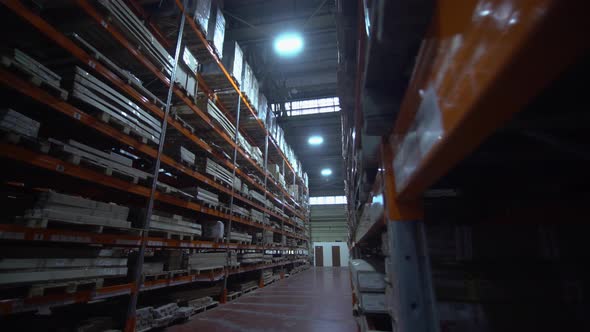 Warehouse with Cardboard Boxes Inside on Pallets Racks Logistic Center