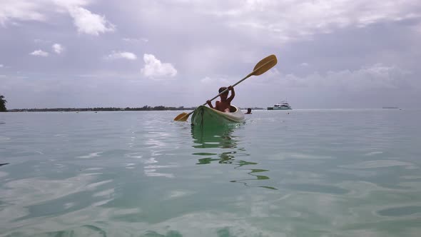 Boy in a yellow kayak