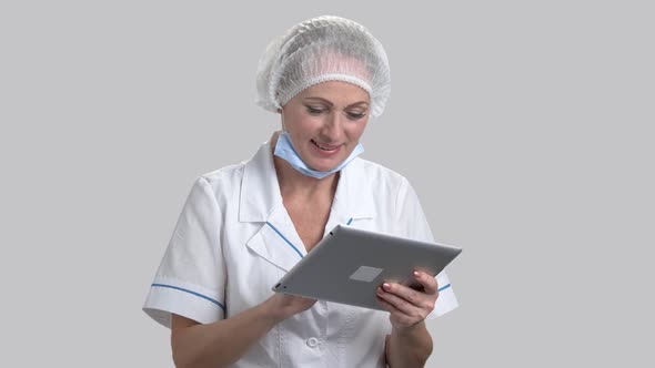 Female Doctor Using Computer Tablet.