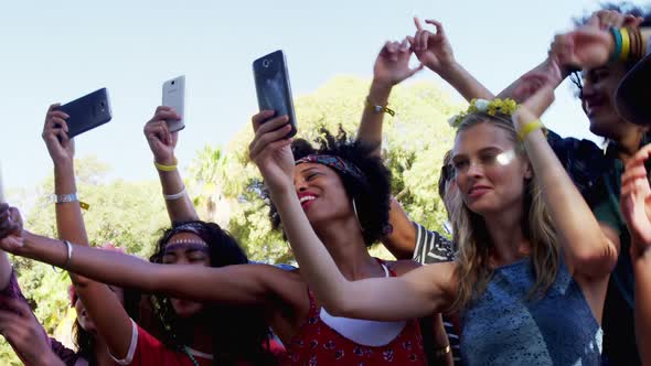 Female friends having fun at music festival