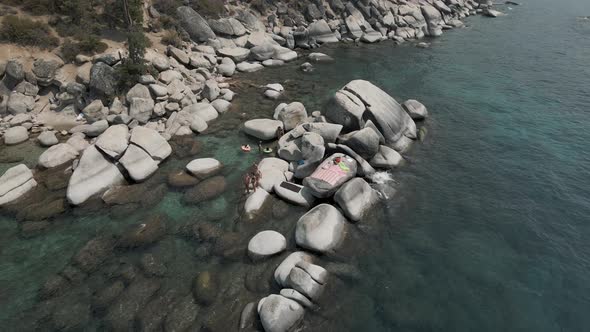 Beautiful ladies relaxing on the rocks