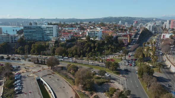 Aerial dolly in over Viña del Mar city buildings and luxury resorts, traffic in avenues and hills in