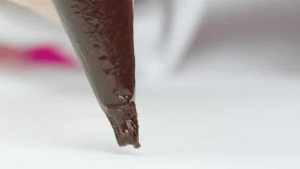 Closeup Squeezing Ganache Cream Out of Pastry Bag, Handmade Truffle Candies