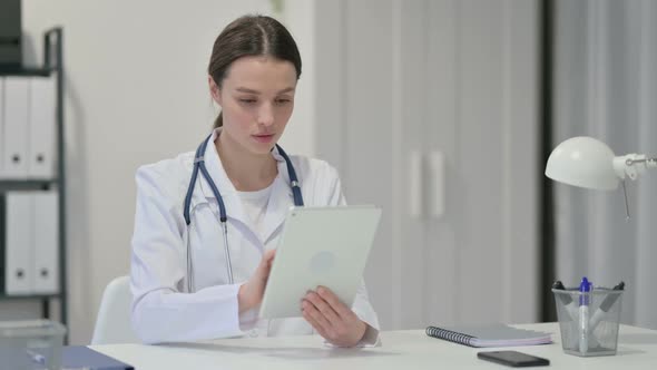 Female Doctor Using Tablet