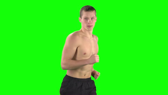 Athletic Man Running. Green Screen