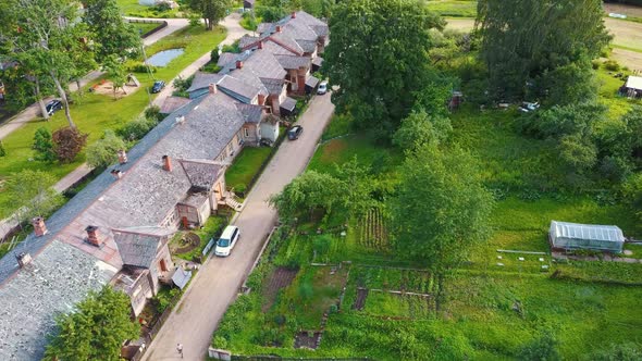 Old Wooden Houses Built for Paper Mill Workers in Ligatne. Wooden Row House 4K Aerial Shot	