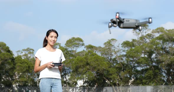 Woman control flying drone