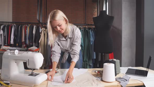 Dressmaker Working with Measuring Tape