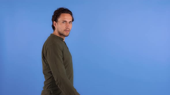 Young Bearded Man in Khaki Colored Shirt