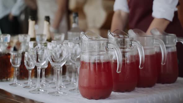 Closeup of Buffet Table on Table There Are Glass Jugs with Cool Fresh Drink