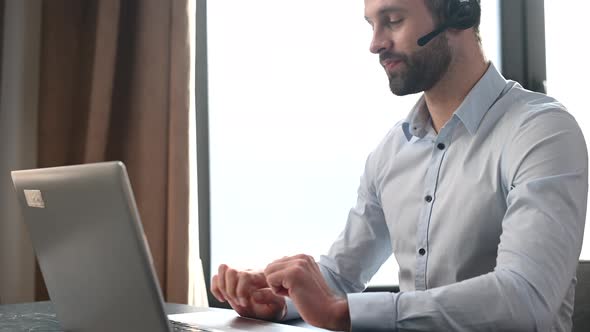 Portrait of Handsome Young Businessman in Headset