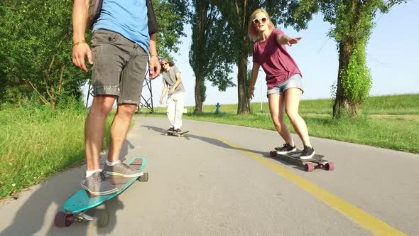 Close view of man longboarding with friends