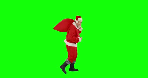 Santa claus holding a bag full of gifts 4k