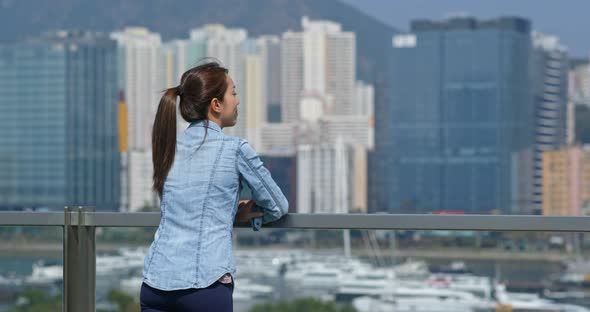 Woman look at the city in Hong Kong