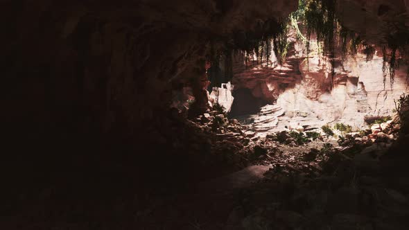 Sunlight Penetrates and Illuminates the Exit From the Cave