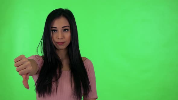 Young Attractive Asian Woman Disagrees - Green Screen Studio