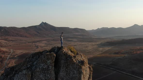 A Man Climbed To the Top of the Mountain He Dances with Happiness and Joy Man Is Basking and Bathes