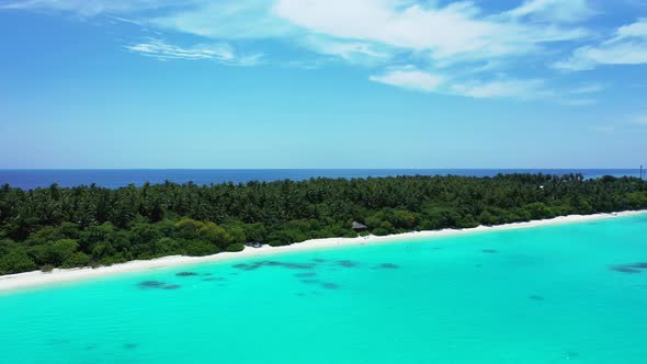 Beautiful above copy space shot of a paradise sunny white sand beach and blue sea background in colo