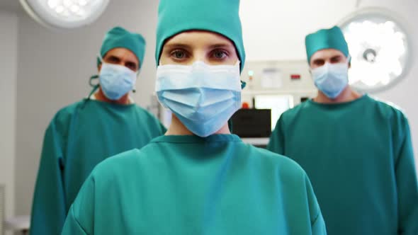 Portrait of medical team standing in operating room