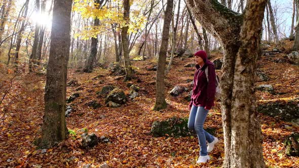 Walking Women in the Autumn Forest Enjoying the Nature